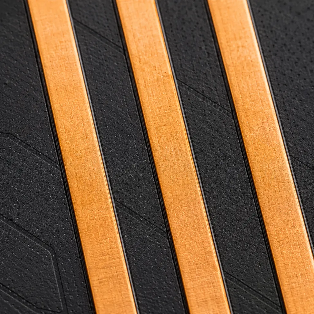 Extreme macro photograph of parallel PCB traces with visible capacitive coupling between adjacent copper lines on dark substrate