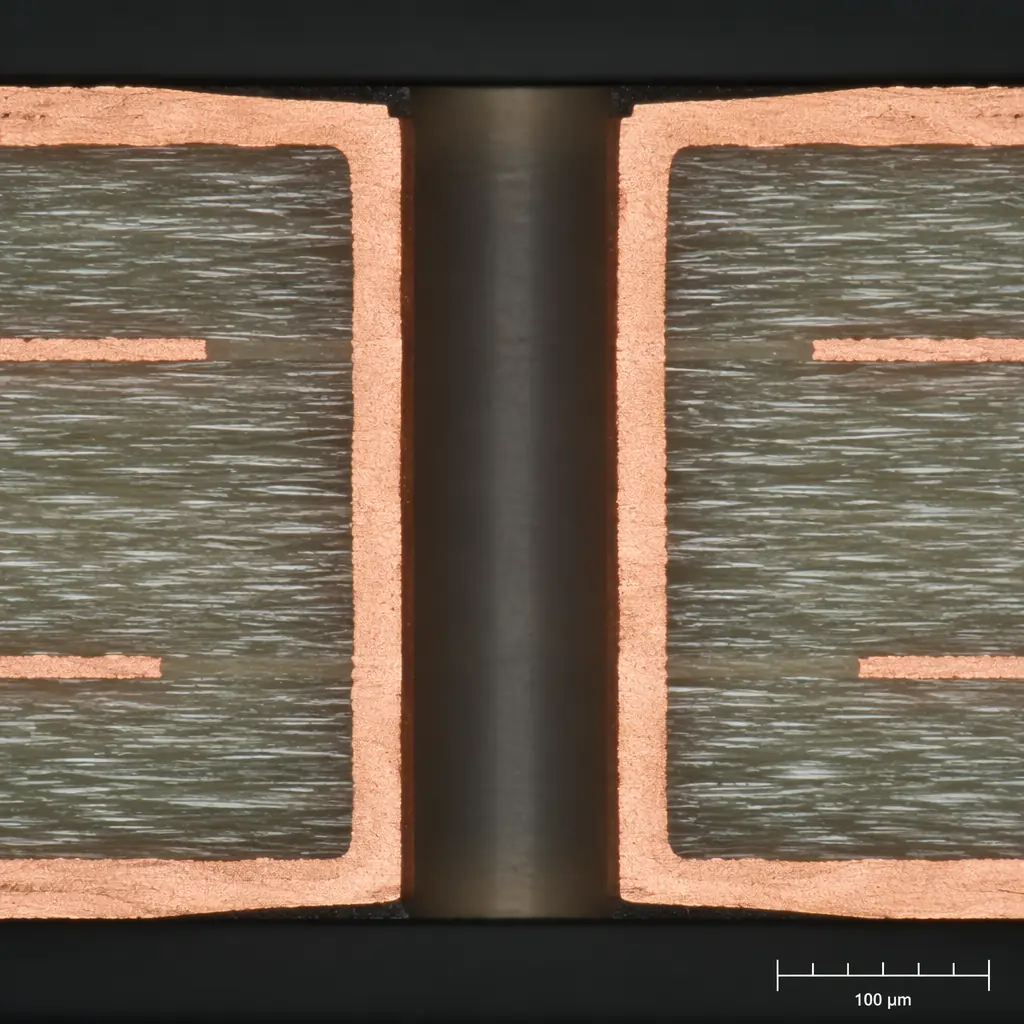 Microscope cross-section image of a 6oz copper PCB via showing uniform copper plating thickness through the barrel and good adhesion to the FR-4 substrate layers